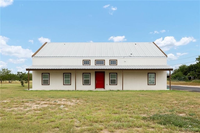 11115 N La Homa Rd, Mission, TX 78574 - rear view of house with a yard, stucco siding, and metal roof