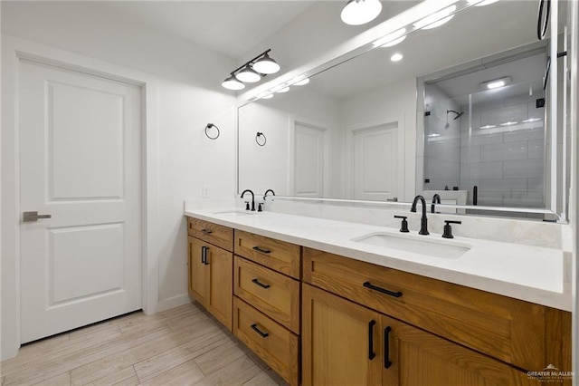 11115 N La Homa Rd, Mission, TX 78574 - full bathroom with double vanity, a stall shower, wood finished floors, and baseboards