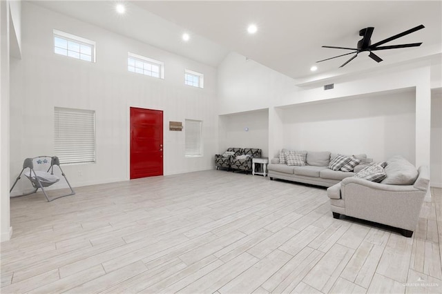 11115 N La Homa Rd, Mission, TX 78574 - living room featuring a towering ceiling, ceiling fan, light wood-type flooring, and recessed lighting