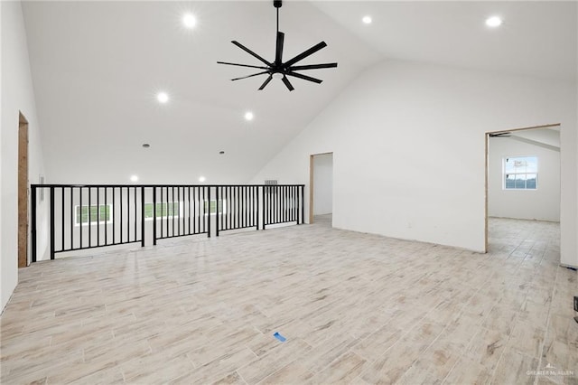 11115 N La Homa Rd, Mission, TX 78574 - empty room with high vaulted ceiling, a ceiling fan, recessed lighting, and wood finished floors