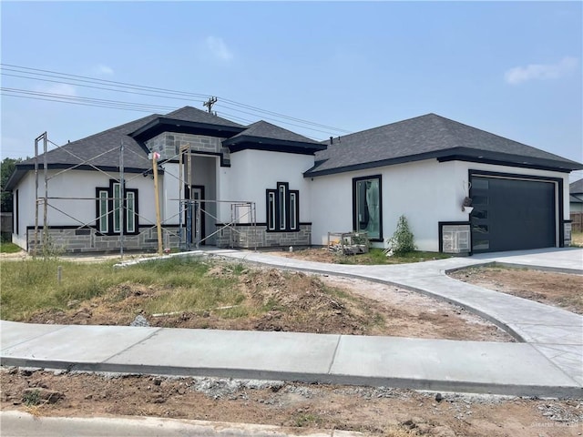 3308 E Kennedy Ave, Alton, TX 78573 - view of front of property featuring an attached garage, stucco siding, and roof with shingles