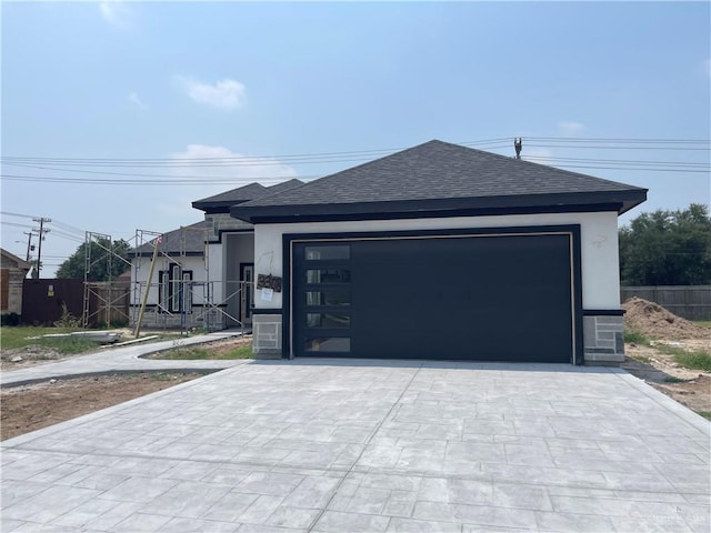 3308 E Kennedy Ave, Alton, TX 78573 - view of front facade with a shingled roof, stucco siding, and driveway