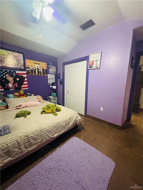 bedroom featuring baseboards, visible vents, a ceiling fan, tile patterned flooring, and vaulted ceiling