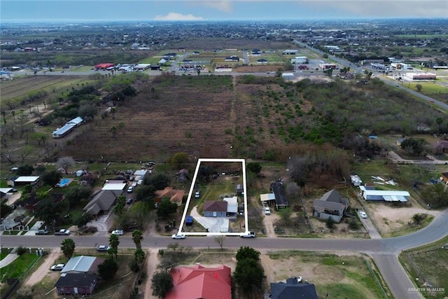 birds eye view of property with a residential view