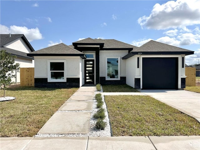 1922 Lime St, San Juan, TX 78589 - view of front of house with an attached garage, stucco siding, concrete driveway, and a shingled roof