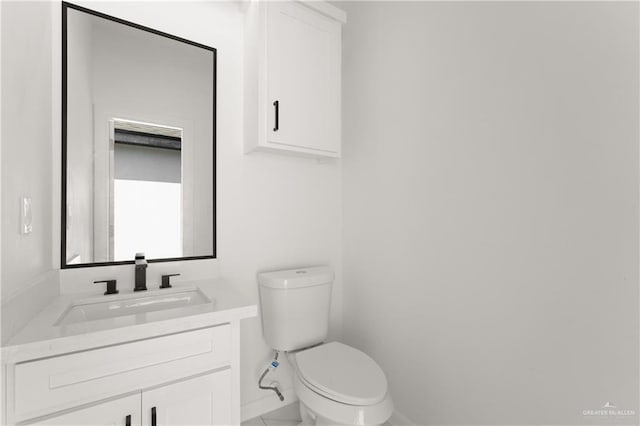 1922 Lime St, San Juan, TX 78589 - bathroom with toilet, vanity, and baseboards