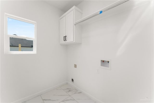 1922 Lime St, San Juan, TX 78589 - laundry room featuring cabinet space, hookup for a washing machine, baseboards, and light marble finish flooring