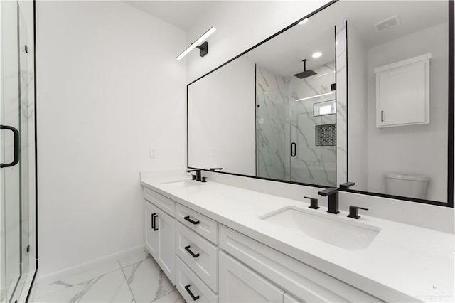 1922 Lime St, San Juan, TX 78589 - full bathroom featuring marble look tiles, baseboards, a marble finish shower, double vanity, and toilet