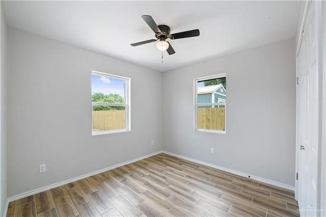 314 N Veterans Blvd, Edinburg, TX 78541 - spare room with plenty of natural light, wood finished floors, baseboards, and ceiling fan