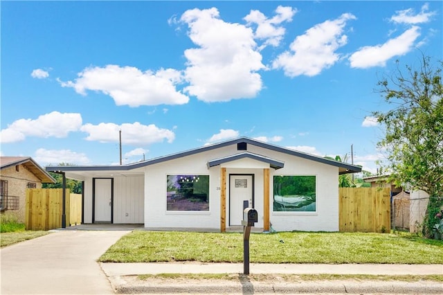 314 N Veterans Blvd, Edinburg, TX 78541 - view of front of house featuring concrete driveway and brick siding