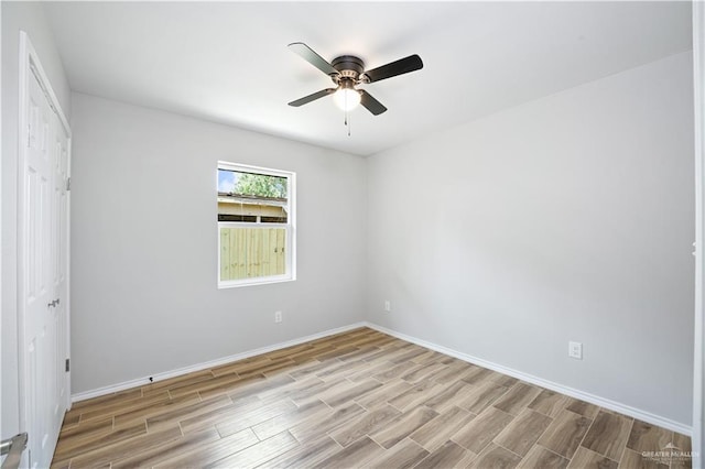 314 N Veterans Blvd, Edinburg, TX 78541 - unfurnished bedroom with wood finished floors, baseboards, and ceiling fan