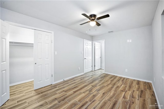 314 N Veterans Blvd, Edinburg, TX 78541 - unfurnished bedroom with light wood-type flooring, a closet, and a ceiling fan