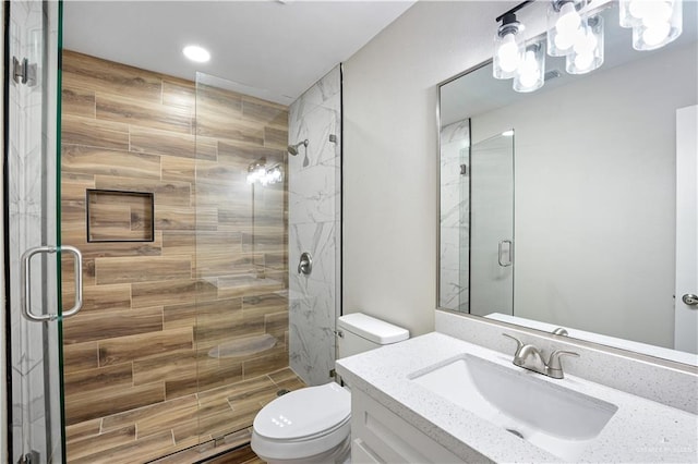 314 N Veterans Blvd, Edinburg, TX 78541 - full bathroom featuring toilet, a stall shower, vanity, and recessed lighting