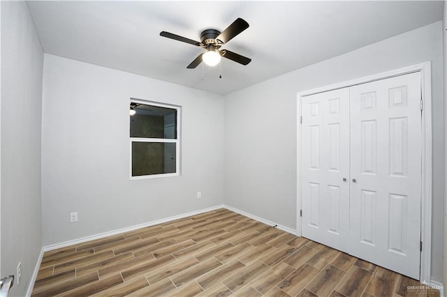 314 N Veterans Blvd, Edinburg, TX 78541 - unfurnished bedroom featuring wood finished floors, a closet, and a ceiling fan