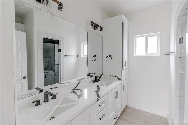 3414 Bamboo Palm Ct N, Harlingen, TX 78552 - bathroom featuring a wealth of natural light, double vanity, and a sink