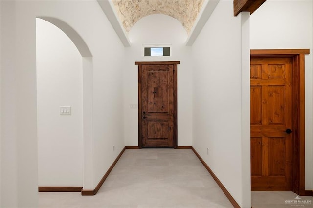 foyer featuring lofted ceiling