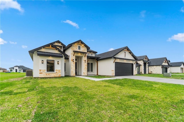 136 Finch Ln, Los Fresnos, TX 78566 - modern inspired farmhouse with stone siding, driveway, a garage, and a front lawn