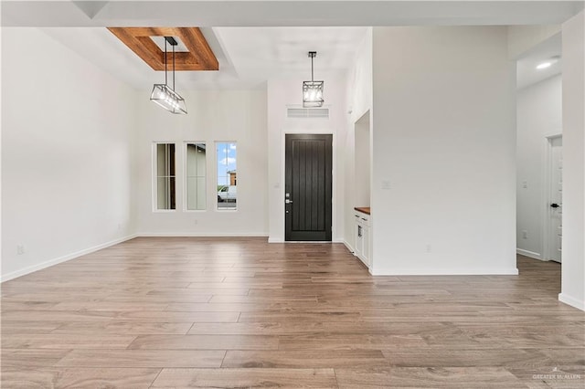 136 Finch Ln, Los Fresnos, TX 78566 - foyer entrance featuring a towering ceiling, light wood finished floors, and baseboards