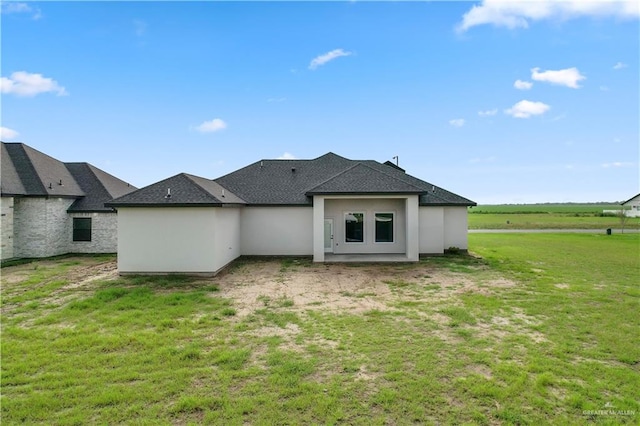 136 Finch Ln, Los Fresnos, TX 78566 - back of house featuring a yard and roof with shingles