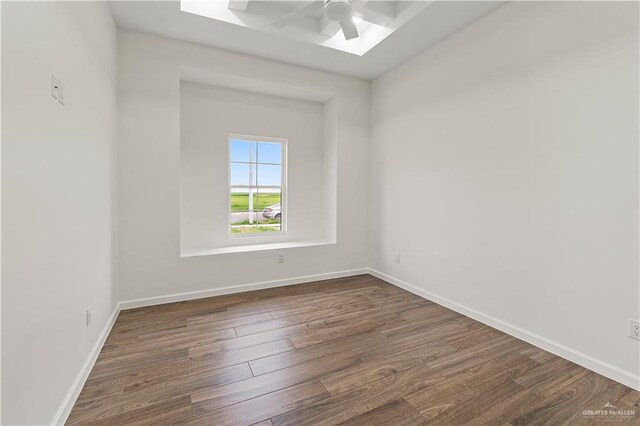 136 Finch Ln, Los Fresnos, TX 78566 - empty room featuring ceiling fan, dark wood-style floors, and baseboards