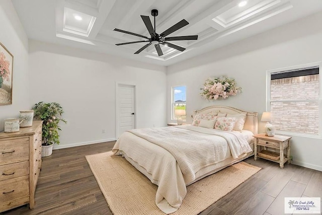 136 Finch Ln, Los Fresnos, TX 78566 - bedroom featuring coffered ceiling, dark wood finished floors, baseboards, beamed ceiling, and ceiling fan