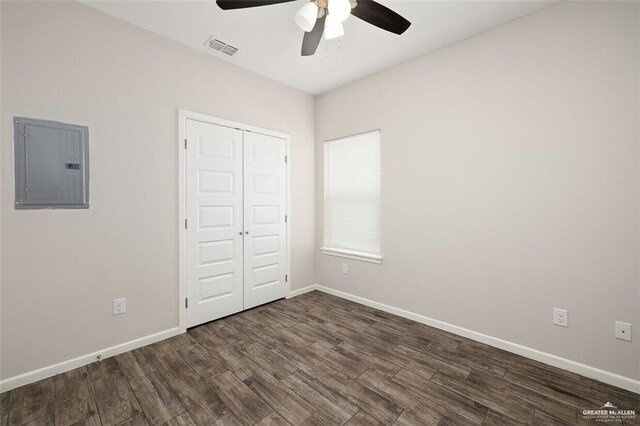 904 Kentucky St, Alton, TX 78573 - unfurnished bedroom with electric panel, wood finished floors, a closet, and a ceiling fan