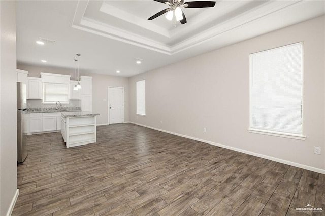 904 Kentucky St, Alton, TX 78573 - kitchen featuring freestanding refrigerator, open shelves, open floor plan, dark wood-style flooring, and recessed lighting