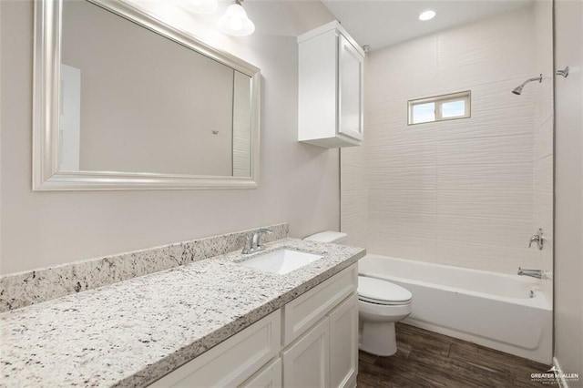 904 Kentucky St, Alton, TX 78573 - full bathroom featuring vanity, tub / shower combination, and wood finished floors
