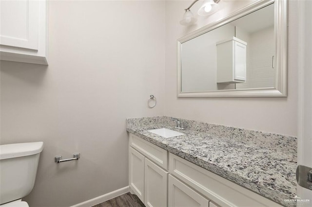 904 Kentucky St, Alton, TX 78573 - half bathroom with vanity and wood finished floors