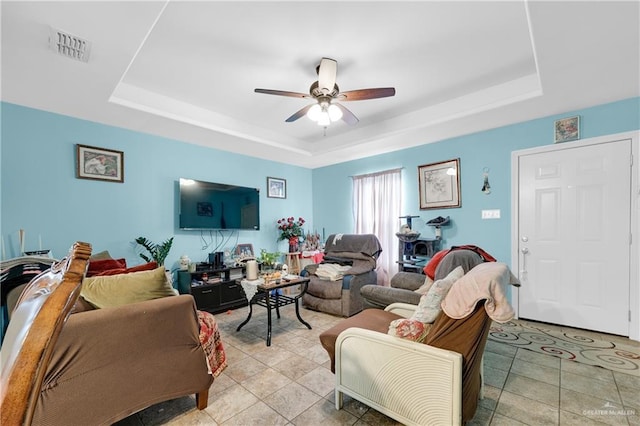 722 E Fay St, Edinburg, TX 78539 - living room featuring a raised ceiling and a ceiling fan
