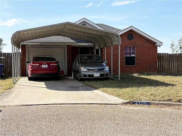 view of front facade featuring a carport and a garage