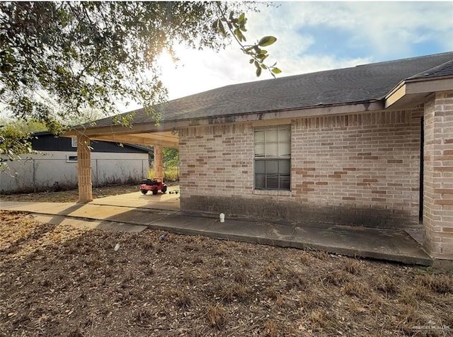 view of side of home featuring a patio