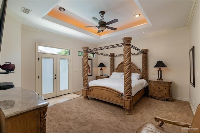 bedroom with access to outside, french doors, a raised ceiling, ceiling fan, and light colored carpet