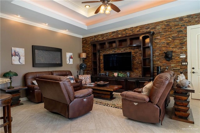 living room featuring a raised ceiling, ceiling fan, crown molding, and light tile patterned floors