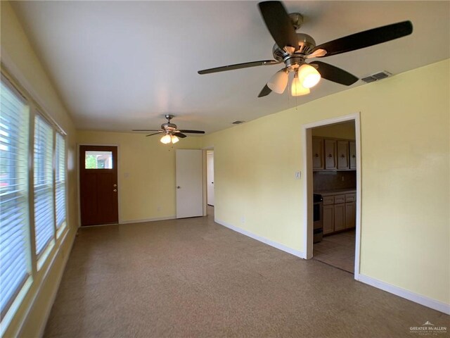 205 W Beck St, Harlingen, TX 78550 - spare room featuring baseboards and a ceiling fan