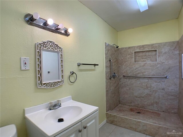 205 W Beck St, Harlingen, TX 78550 - full bathroom featuring a tile shower, vanity, and tile patterned floors