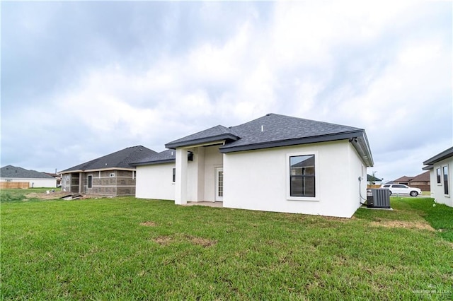 536 Pearl St, Edinburg, TX 78539 - rear view of house with cooling unit, a shingled roof, and stucco siding