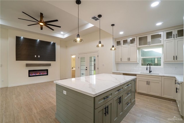 536 Pearl St, Edinburg, TX 78539 - kitchen with a sink, open floor plan, gray cabinets, light wood-style flooring, and recessed lighting