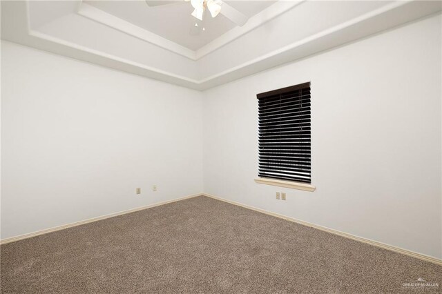 313 Royal St, Edinburg, TX 78539 - empty room featuring a raised ceiling, carpet, a ceiling fan, and baseboards
