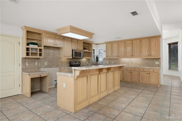 313 Royal St, Edinburg, TX 78539 - kitchen featuring open shelves, light countertops, stainless steel microwave, and tasteful backsplash