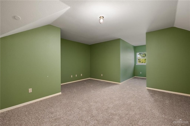 313 Royal St, Edinburg, TX 78539 - additional living space with baseboards, vaulted ceiling, and carpet