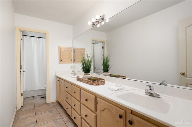 313 Royal St, Edinburg, TX 78539 - bathroom with double vanity, tile patterned floors, baseboards, and a sink