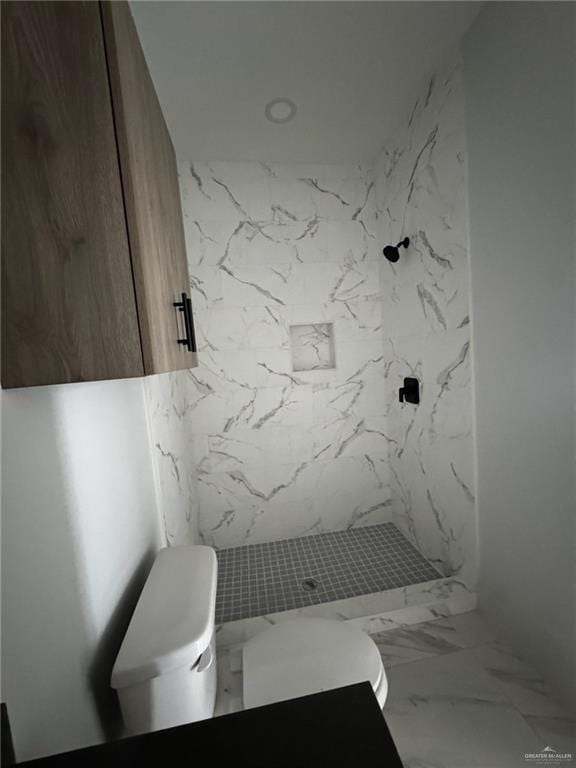 2809 Alpha Rd, Weslaco, TX 78596 - bathroom featuring marble finish floor, toilet, and a shower stall