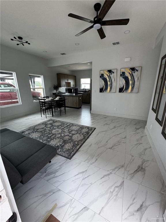 2809 Alpha Rd, Weslaco, TX 78596 - living area featuring marble finish floor, baseboards, visible vents, ceiling fan, and recessed lighting