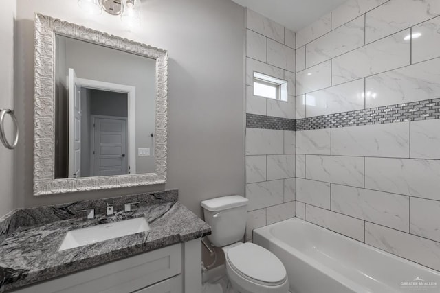 full bathroom featuring vanity, toilet, and tiled shower / bath
