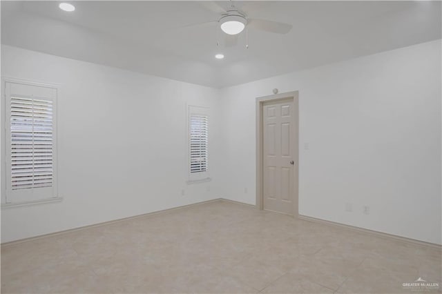empty room featuring a ceiling fan, recessed lighting, and baseboards