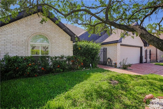 view of front of property with brick siding and an attached garage
