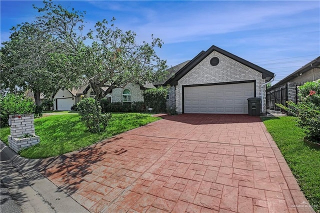 view of front of property with decorative driveway and brick siding