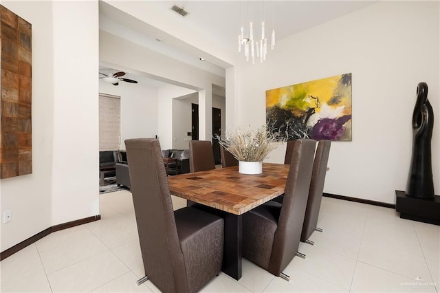 dining room with light tile patterned flooring and ceiling fan