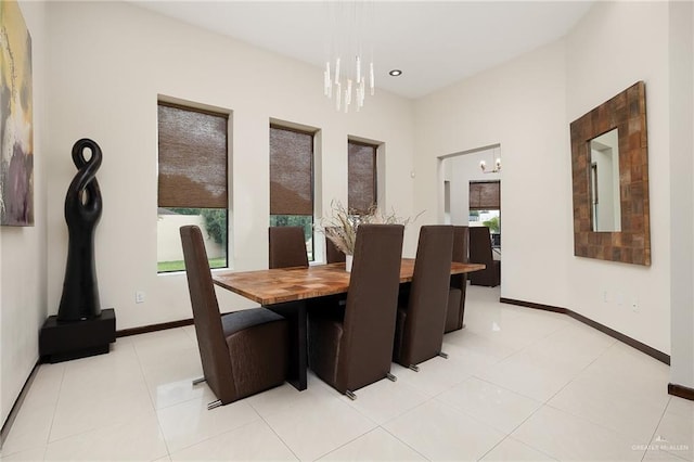 dining room featuring an inviting chandelier, light tile patterned floors, and a wealth of natural light